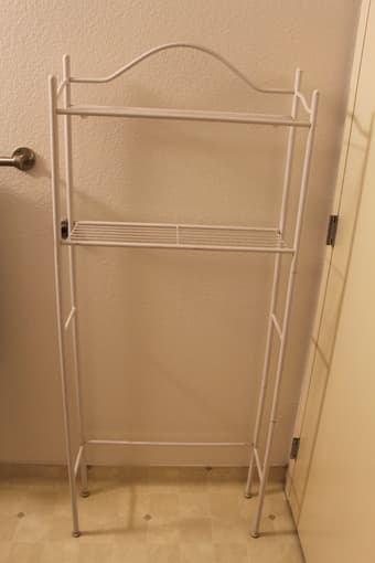 bathroom shelves over toilet and large garbage can 1