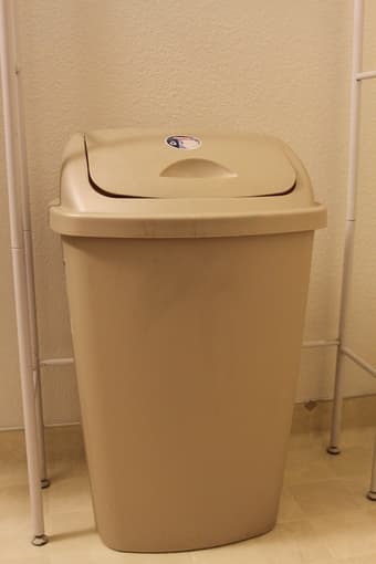 bathroom shelves over toilet and large garbage can 3