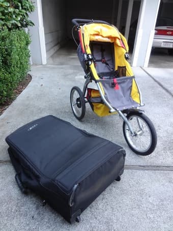 BOB ironman Stroller (with weather shield and traveling bag) = $180 3
