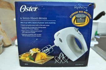 Oster 6 speed hand mixer with storage bag - $20 1