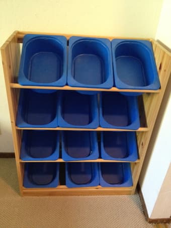Shelves with buckets for holding kids toys 1