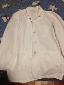 Medical school books and white coat 2