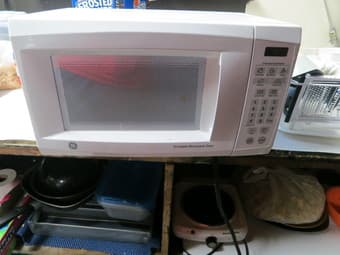 GE Microwave:  0.7 cu foot, white -- $25 obo 1