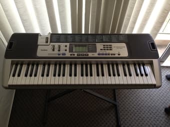 Casio LK-100 61 key keyboard with stand (asking $60) 1