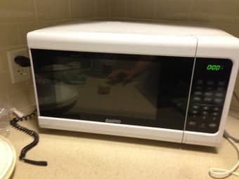 mid-size microwave in good condition -- 49 1