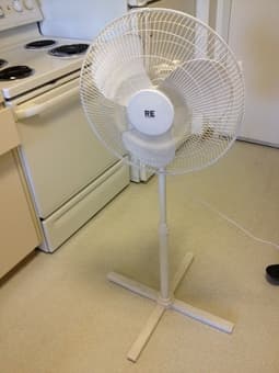 whiteboard, small lamp, side table, and fan 3