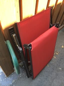 2x Red outdoor lounge chairs - great for patios or beach days 2