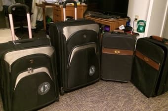 mid-sized luggage / suitcase - $25 3
