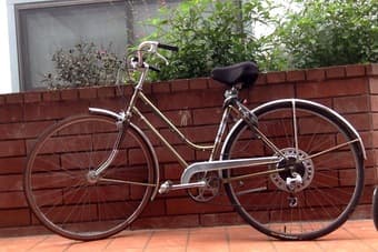 golden vintage bike, woman 1