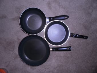 several kitchen items (cooking pot, pans, glass food storages) 1