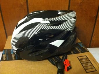 Woman mountain bike with basket and helmet 2