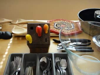 lots of household items: coffee maker, wine opener, can opener... 1