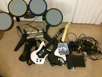 Playstation 2 slim with Rock Band 2 - drum set and guitars $50 1
