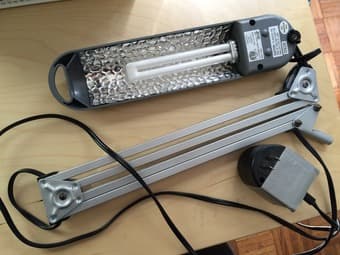 Table-mounted fluorescent task lamp with swing-adjustable arm ($5) 1