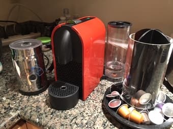 Nespresso U, Aeroccino Milk Frother, and capsule carousel - $125 1