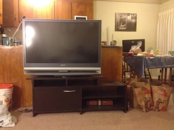 A huge TV and TV stand $150 1