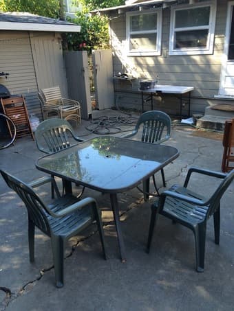 Glass outdoor table with plastic chairs 1