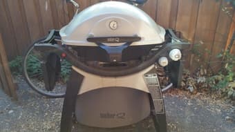 Gas grill plus half-full propane tank for $100 1