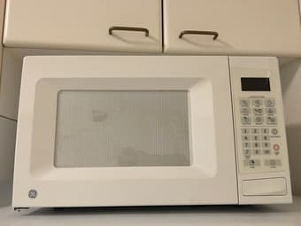 For Sale: Microwave, Floor lantern, iron board, skis+poles etc. 1