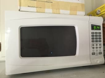 White 700 watt Microwave Oven. 2