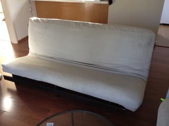 Tan futon with solid wood frame $220 1