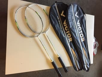 Two badminton rackets with bags 1