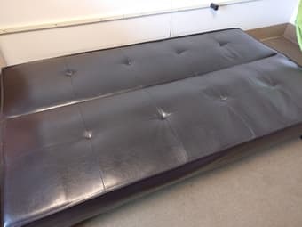 Black leather futon, less than a year old! 3