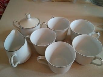 Cute set of tea cups along with milk pitcher and sugar bow 1