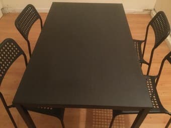 A full wooden tale with four chairs for study and dinning. 1