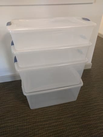 Four Sterilite storage bins with lids 1