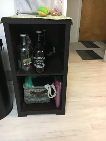 Ikea shelf units, decorative items, area rugs, tall bar stools 3