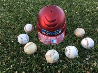 BASEBALL HELMET AND 7 BASEBALLS 1