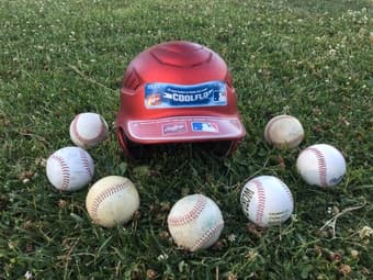 BASEBALL HELMET AND 7 BASEBALLS 2