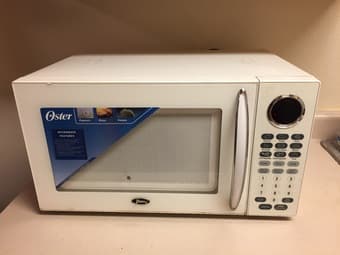 Microwave Oven, Oster (1.1 cu ft capacity, 1000 watts) 1