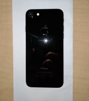 iPhone 7 (128 GB; brand new, UNLOCKED) in Jet Black + Spigen Case 3