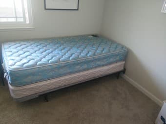 Twin size bed: 2 Serta Mattresses and a metal frame with board &wheels 1