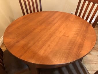 Wooden round dining table with 4 cushioned chairs 2