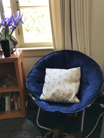 Navy blue saucer chair + decorative pillow 1