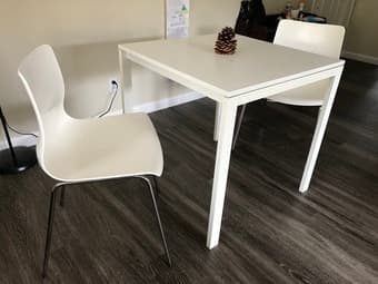 White table and two white chairs from ikea 2