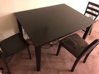 A dining table with chairs. 1