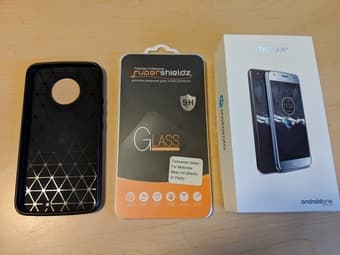 Android One Moto x4, with original charger, box, a case, and 1-2 glass 2