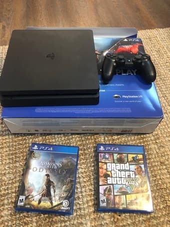 PS 4 slim 1TB like new with 2 games 1