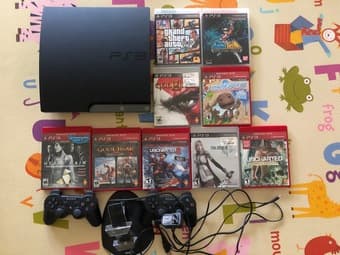 PS3 + Controllers + charging station + 9 games 1