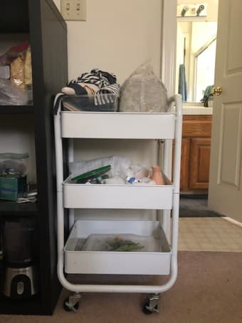 white metal three-tier storage cart on wheels 1