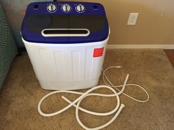 Portable washing machine with hose. 1