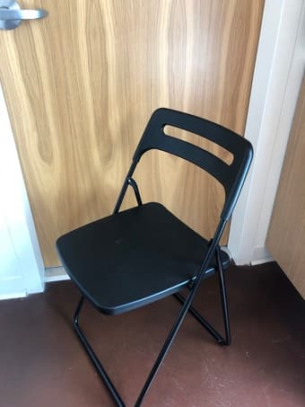 Black folding chair 1