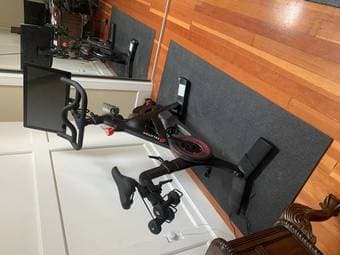 Lightly Used Peloton Bike with 3 lb weights and mat 1