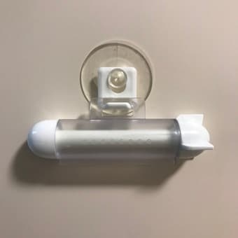 Kitchen/bathroom organizer and toothpaste squeezer 3