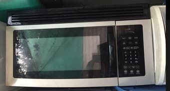 Over-Stove Microwave Oven with Lights and Vent Fans. 1