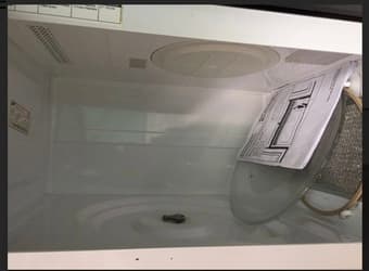 Over-Stove Microwave Oven with Lights and Vent Fans. 2